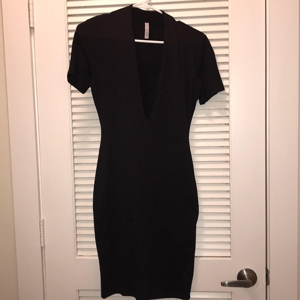 Form fitting low cut dress
